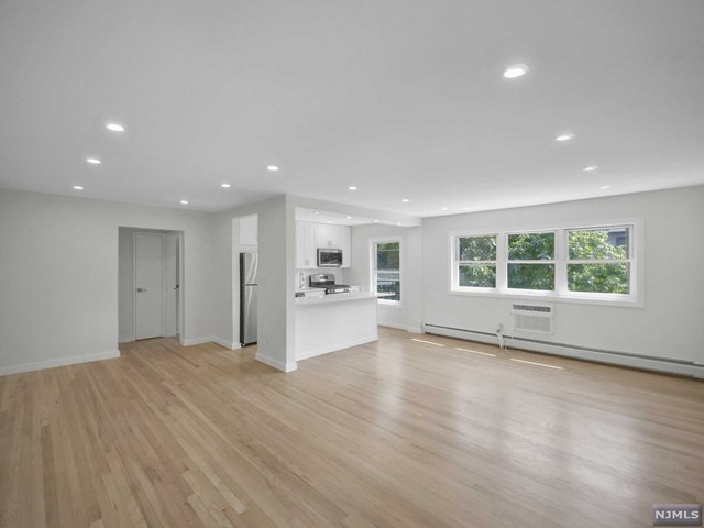 Beautifully renovated second floor apartment at end street apartment. Very well maintained building. Rent includes heat/water/hot water and an assigned parking space. Coin-laundry in basement. Extra storage located in the building. Close to NYC transportation, shopping, and schools. 5 Minutes to the GWB. Sorry no pets, no guarantor. Renters insurance required. Refundable fee $250.