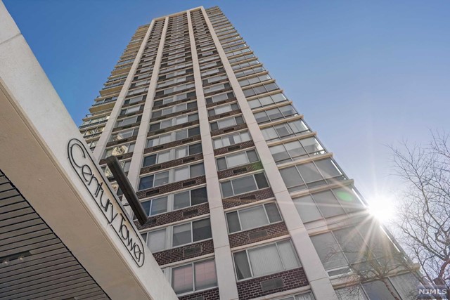This must see 2 bedroom/2bathroom corner unit features an open floor plan with unobstructed west and north exposures that afford magnificent sunset views. Generous sized rooms throughout include eat-in kitchen with plenty of cabinetry and a large window. Parquet wood flooring is under all carpet. The bonus is the floor to ceiling glass den, which offers possibilities as an office or an additional guest room. Primary bedroom features additional built-in closets and ensuite bath. Laundry is per floor. Century Tower offers luxury living with a full range of amenities: 24 hr doorman and concierge, attended garage, outdoor pool, state of-the-art fitness center, community room, kid's playroom, BBQs and more! Conveniently close to many restaurants, good schools, Houses of Worship, highways and easy transportation to NYC. Parking $90. Subject to Board approval.