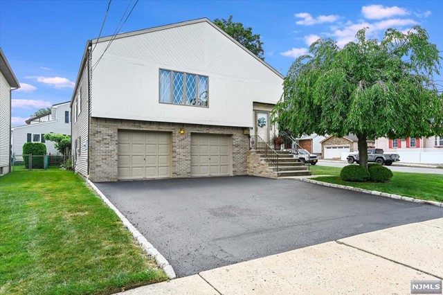 Live in your own HOME! This four bed, three bath, bi-level rental is located on a corner property in a quiet neighborhood. This home is much larger than it appears with a two-car built in garage and access to ground level from rear. TWO large levels of living. First level offers a sizable living room that is adjacent to a formal dining room. Eat in kitchen is spacious enough for a large dining table. There are three good sized bedrooms with a shared bath in hallway and primary bedroom has its own bath! Ground level feels like a bonus house within the home with a full bath, large living room, dining and kitchen area, and a fourth bedroom. Access with sliding doors to backyard with patio area and zen-like scenery with manicured landscape. This property is located steps to park, Clifton Commons shopping center, route 3 to NYC, public transportation, and ON3 Campus. Come see this beautiful bi-level home!