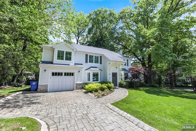 Presented by Bahr Rapaport 917.848.1784 Completely re-built in 2014, Center Hall Colonial, with quality craftsmanship throughout, located in sought after residential neighborhood. This warm and inviting home has it all! Entrance Foyer with center stairwell, living room with fireplace and sliders to back patio, sun-lit family room with high ceilings, formal dining room, eat-in-kitchen with marble countertops and stainless steel appliances. The second floor features a master suite with trey ceiling, luxurious master bath and walk-in-closet, bedroom with en suite bath, two additional bedrooms and hallway bath. The basement is finished with a large rec room, bedroom, full bath and storage space. Additional features: Hardwood floors t/o, Porcelanosa tiles in kitchen and baths, Hardy Plank siding, Heated garage, EZ Breathe Ventilation System in basement, Set up for full house generator, central vac, sprinkler system. This exceptional residence will meet your highest expectations