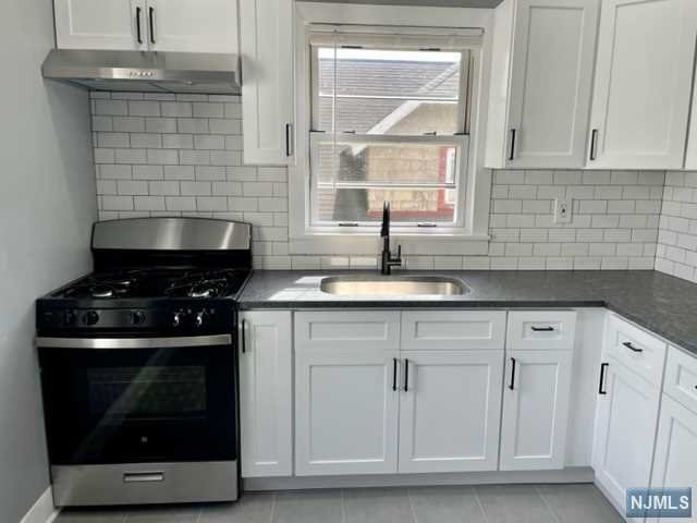Walk into this lovely 2nd floor apartment in a top/bottom 2-Family home. 2BR's and 1 FBath, Newly renovated Kitchen, brand new cabinets, granite counters, tiled flooring, and SS Appliances. Brand new fully tiled Full Bath standup shower and glass shower enclosure. Large bedroom with bonus room/walk in closet, 2nd bedroom, and LR, pergo wood floors, additional storage in the attic. Close to NYC transportation walk to bus and train, close to shopping, restaurants, and houses of worship. No pets. Includes heat and water. Tenant responsible for 1 1/2 months security. 1 month Broker Fee.