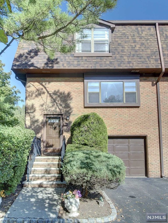 Come home to the tranquility of this secluded end unit townhome, where a unique charm awaits. With a few deer as your neighbors, relish in the three levels of living that this space offers. The top level hosts two bedrooms featuring WICs and a fully updated bath. On the second level, bask in the brightness of the spacious living room, a separate dining room, and a spacious eat-in kitchen. Alternatively, find solace on the lower level, conveniently situated at ground level, presenting a recreational space, laundry area, and doors leading to the backyard private or opt for the ease of accessing your unit directly from your private garage. This home invites you to infuse your personal touch, bringing your remodeling ideas to life and making it uniquely yours.