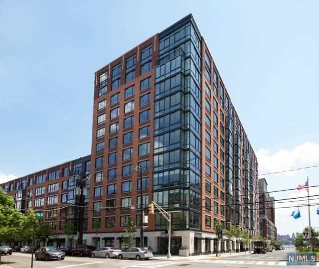 Rare to find a true 3 Bedroom, 2.5 bath unit in the premier waterfront luxury building, 1100 Maxwell, with ultra convenient garage parking included. This unit features 6' White Oak hardwood floors, an upgraded Bosch fridge, Pottery Barn light fixtures, West Elm wallpaper in the half bath, new silhouette shades in all rooms, along with a top of the line Electrolux washer and vented dryer. The kitchen features a center island w/ quartz countertops, Viking range, Bosch dishwasher, a double door pantry/storage along with plenty of cabinet space. The building offers 24-hr concierge service, 2 gyms, 2 pools, 2 resident lounges, a roof-top terrace with BBQ grills and fire pits, 2 children's play rooms, and a free shuttle to and from the Hoboken Path. This building is just steps away from the NYC ferry, shops and restaurants. The unit comes with 1 deeded parking spot onsite conveniently located right next door to the unit.