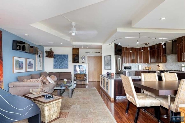 ALL UTILITIES & TAXES INCLUDED IN FEES! 3 bedroom/2 bath Downsplit Townhome style home on 3 Levels. Many upgrades-Plank flooring, Custom doors, Outfitted closets, Recessed lighting, Architecturally Redesigned Open Kitchen with custom Cabinetry, GE Stainless appliances, Quartz countertops, and Mosaic tile backsplash. Entertaining space opens to 24' Balcony with views of the Hudson River, GWB, and Horizon's gardens. Lower level has West Sunset Views with 2 spacious bedrooms with a renovated Full Bathroom, and a Master Bedroom Suite with En Suite Renovated bath and Walk-in Closet. Amenities include: 24 hr. Doorman, security, community room, gym, 2 pools, tennis, play areas, Fitness Rooms, 32 acres of beautifully manicured grounds, and convenience store on premises. TOTAL Monthly Fees $2681.34 (maint $2233.11,,park $96,cbl/Int $48.90,cap. Ass $303.33). Min. Gross income for cash buyer to qualify w/no mortgage or debt $128K.