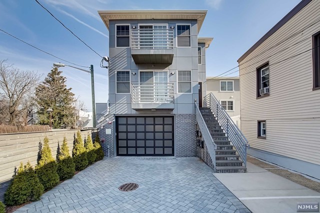 Spacious 3 bedrooms, 2 bathrooms condo at an exceptional price! This boutique condo, constructed in 2018, offers 1857 SQ. FT of living space and 2 car parking! Distinct characteristics include an open layout with large rooms and a modern kitchen with SS appliances, quartz countertops, a breakfast bar, and plenty of cabinets. Additional features include central AC/Heat, in-unit washer/dryer, chic bathrooms with marble tiles, recessed lighting, and hardwood floors. Located near direct NYC buses for an easy commute to Port Authority. Also near Washington Park and a short drive to Trader Joe's and Whole Foods. High Walk Score and common amenities, such as food, shopping, parking, and more in close proximity.