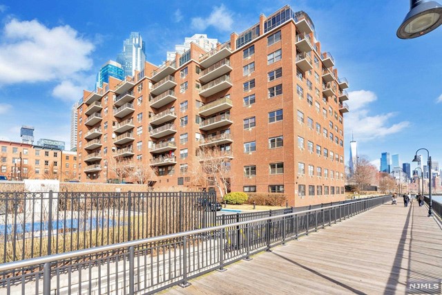 Location, Location, Location! Waterfront luxury living with breathtaking views of the Statue of Liberty, Hudson River, Morris Park and pool. NJ light rail just a few feet away. Easy commute to NYC. Large 2 bedroom with hardwood floors, washer/dryer in the unit. Building features doorman, elevator, pool, gym, parking, sky lounge and community room. This is the home that offers everything you've been dreaming of. Come to see it today!