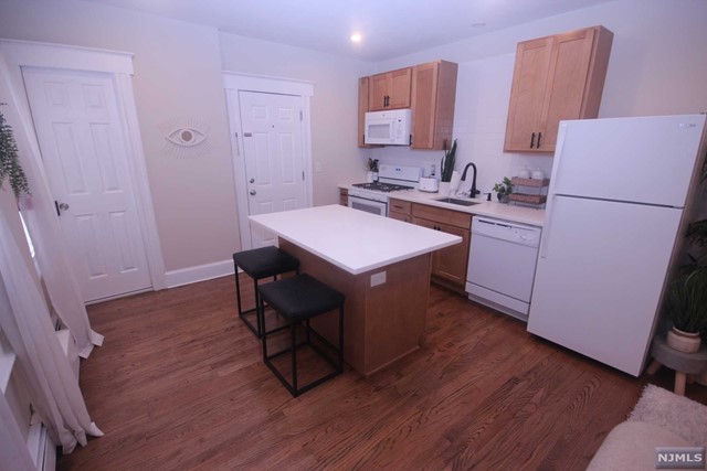 Stunning recently renovated apartment with open floor plan. Kit w/ center island, quartz countertop, open to living area, new hardwood floors, new bath. Refrigerator, D/W, microwave provided by landlord. Tenant pays gas and electric. One off-street parking space provided. Close to NY express bus #161, shopping and park. Pets conditional. Listing agents related to landlord.