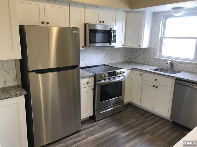 Renovated kit w/granite counter, renovated bath, new floors. LL provides refr, micro, d/w. W/D h/u in basement, 1 off-street parking space provided, good closet space. LL pays cold water, Tenant pays electric for heat, h/w and cooking. LL maintains lawn & snow removal. Tenant has shared use of front yard.