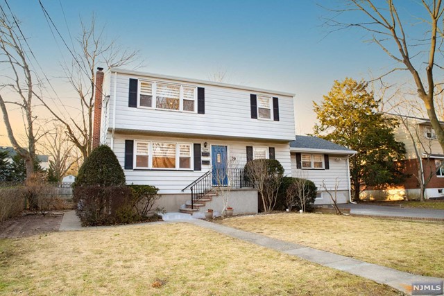 MOVE IN READY. This expanded first floor unit generously offers 3 bedrooms and 2 full baths. Large Primary Bedroom with Full Bath. Renovated kitchen with SS appliances, renovated bathrooms, Central A/C, recessed lighting, custom window treatments, and beautiful hardwood floors throughout. Large recreation room in basement with laundry and additional storage. Outside you'll find a fenced-in backyard and renovated deck off the family room. 2 car assigned parking on driveway. Top rated school system, plenty of restaurants, cafes, movie theatre, groceries, shopping, houses of worship, and great, family-friendly parks very close by. Easy NYC commuting, access to major highways, and Englewood Hospital minutes away. Landlord provides lawn care.
