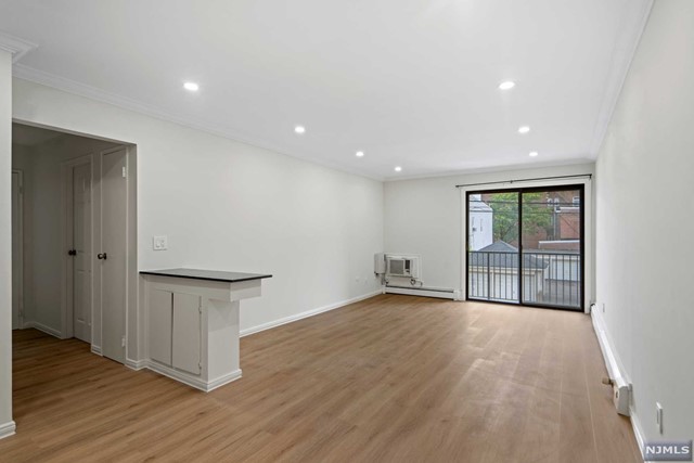 Discover your new home in this beautifully updated 1-bedroom, 1-bathroom apartment in the heart of North Bergen, NJ. This cozy, modern unit features recent renovations, including fresh paint and brand-new flooring, creating a clean, inviting atmosphere. Enjoy a bright, airy living space perfect for relaxing or entertaining, along with a private balcony for a peaceful outdoor retreat. Benefit from an assigned parking spot, in-building washer and dryer, and extra assigned storage space. Just steps from James Braddock Park, you'll have access to scenic views, walking trails, and recreational activities. Only a block from Boulevard East, known for its breathtaking views of the NYC skyline, this location offers easy access to transportation for a quick commute into NYC. With a variety of restaurants, shops, and businesses nearby, everything you need is right at your doorstep. This apartment combines modern comforts with a prime location, making it the perfect place to call home.