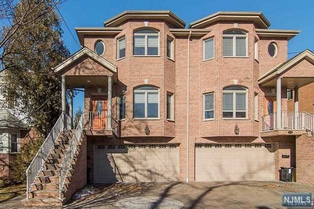Premier Location, Over-sized lot, East-facing home w/tons of natural light, hardwood floors throughout 1st & 2nd flr, Over-sized kitchen with Cherry Cabinets, Granite counters and Lrg center Island, Kitchen opens to the family room with Gas burning fireplace, sliding glass door to deck w/ Sunset views, Very Large Master Bedroom w/ spacious bth and lrg closets with built in shelves, two additional good-sized bedrooms w/enormous closets w/shelving, the full sized washer/dryer on second floor are included, ground level has full bath, separate side entrance and 2 car garage. Close to NYC bus Transportation and all major highways.