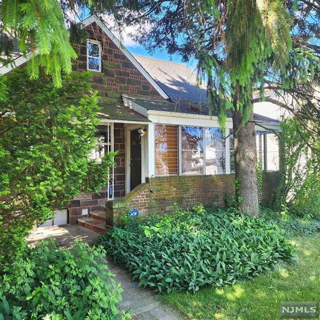 Here is a rare opportunity to rent a 3 BR, 1.5 bath with a two car garage in Fort Lee for under $3,000 per month. This home is full of old world charm. There is a wonderful front slate sitting area. Once you enter the house, their is an enclosed port with great natural light. The house has a nice size living room with fireplace. A formal dining room, eat-kitchen. On the first floor there is also bedroom with a full bathroom. The second floor has two bedrooms and one half bathroom. The basement area has a laundry room and is semi-finished. The property has a two car garage. The house has a large long driveway. Well located with easy access to NYC Via bus to NYC.