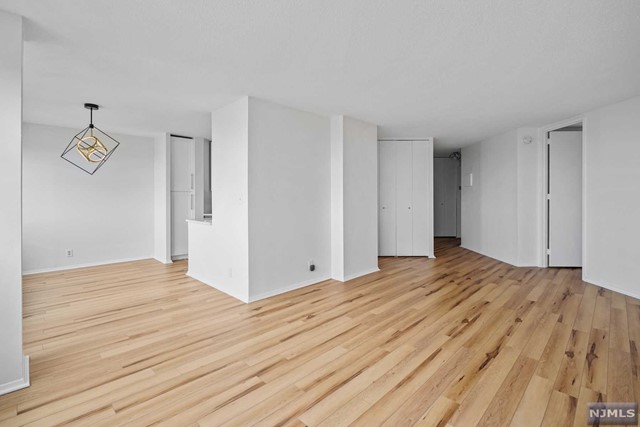 PRICED TO SELL! Unpack your bags and Move-in, this 970sqft, renovated one bedroom with sweeping NYC views is perched on the 49th floor at the full service, amenity rich Galaxy Condos. This sun filled property is large on value and big on living space with a pass-through kitchen, 1.5 bathrooms and ample closet space. Recent renovations include: freshly painted throughout, new floors, new Samsung appliances, new Quartz counters with brass fixtures, contemporary lighting, new two-tone kitchen cabinets, renovated powder room and renovated full bathroom. Building has five star amenities which include but are not limited to: 24 hour doorman, concierge, state of the art gym, inside and outside pool, sauna, steam room, playroom. tennis courts, game room, convenient store, ATM, bank and additional stores on premises. The Galaxy is centrally located near NYC/NJ buses, parks, restaurants and houses of worship. Parking is available for an additional $120 per month.