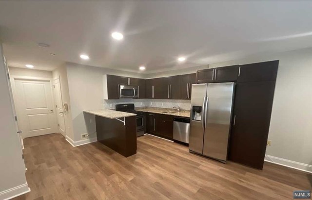 Spacious one bedroom apartment offering an open floor plan. Located on the first floor of the building. This apartment features grade level entrance with no stairs! The apartment features an open concept living area with an eat in kitchen. The kitchen offers stainless steel appliances, a gas oven, and plenty of cabinet space. The bedroom is spacious and separated from the main living area. The apartment offers laundry in the unit, a covered garage parking space, and a community pool. NO pets allowed.