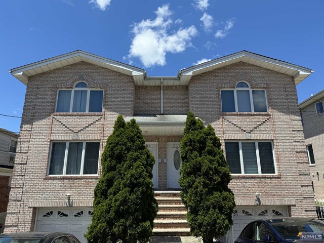 Welcome to this bright and well-maintained duplex! Great flow of living and dining spaces into an updated kitchen with a half bath to round out the 1st floor. Upstairs, you'll find 2 spacious bedrooms, a full bath, and a master BR/BA ensuite with vaulted ceilings. Conveniently located and close to highways, NYC buses, shops, and restaurants. Garage and driveway parking included. Pets conditional. Come see today - more photos to come! Note: basement not included.