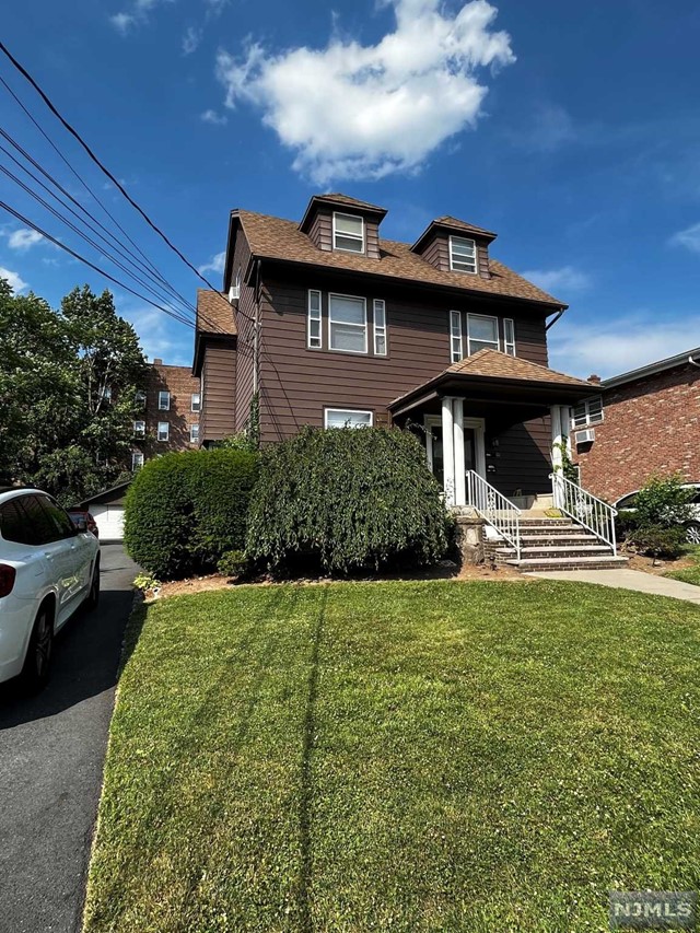 2 bed 1 bath with in unit laundry and 2 parking spaces (1 in garage, 1 out). Literally steps away from Broad Ave and bus to NYC. LL open to MO - MO lease.