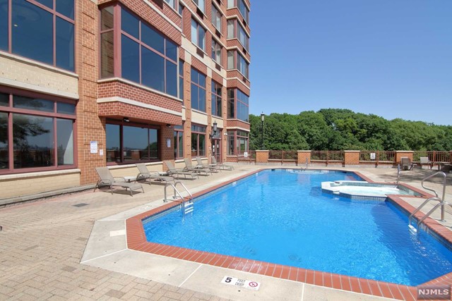 Located overlooking the beautiful Hudson River and New York City skyline, the Palisades is a true luxury building. Amenities include a 24 HR doorman, outdoor pool, fitness center, library, playroom, conference room, cafe, and much more. This bright and spacious one bedroom includes a newer kitchen with stainless steel appliances, herringbone tile, and modern backsplash. There are hardwood floors throughout the unit along with a washer and dryer. Master bedroom offers a spacious closet and view. The Palisades is located within walking distance of transportation to NYC, restaurants, and parks. Call for a showing.