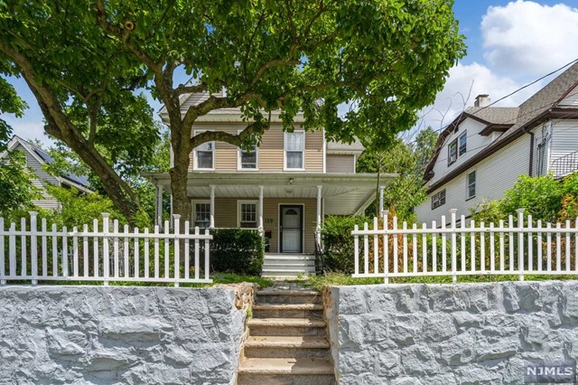 This beautiful home welcomes you with a lemonade porch as you enter this charming four bedroom side hall Colonial. The first floor features a living room, opening to the dining room, with a renovated kitchen. Also a powder room leading to a back porch and the backyard. The second floor offers three bedrooms, and a updated full bath. On the third floor you will find the Master Bedroom, full bathroom, a tremendous amount of storage space. Completing the home with a finished basement and a one car detached garage with exercise room. Great location, close to NYC transportation, parks, schools and Englewood's downtown shops and restaurants.