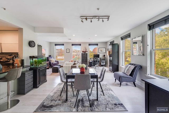 Rarely available, impeccably renovated expansive corner unit in the highly coveted Columbus. North-East park facing, exceedingly quiet sun-drenched condo features a desirable butterfly layout and oversized open-concept living area including space for dining and a private terrace overlooking tree-lined Columbus Park. Boasting chef's kitchen with Italian custom cabinetry, Caesarstone quartz countertops and breakfast bar, metal linear tile backsplash and stainless steel appliances. The primary bedroom features en-suite bath with glass-enclosed shower and Brizo Siderna shower system. The sizeable second bedroom has two large closets for additional storage and the second bath has been beautifully updated. Additional features include wide plank white oak floors throughout, an abundance of closet space, central A/C, in-unit front loader washer/dryer, recessed lighting, ceiling fans, custom window treatments, keyless entry, and one garage parking spot.