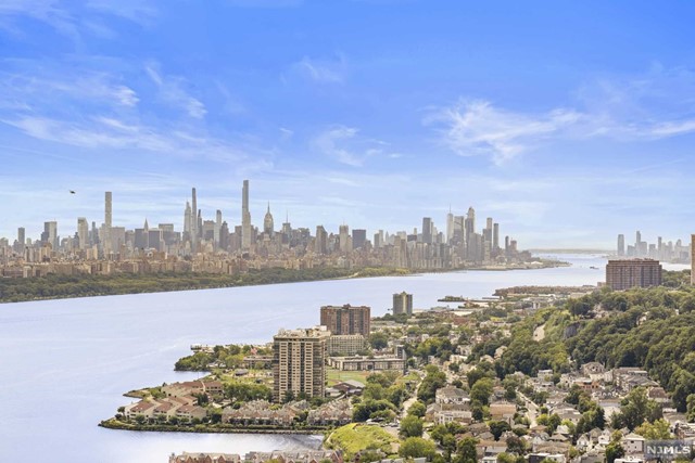 THE CHEN AGENCY presents RESIDENCE 24ABC at RIVER RIDGE. This masterpiece was created by combining three contiguous units into an incredible 4200-sf modern ranch home in the sky. The views from this home are truly astonishing and span the Hudson River from the George Washington Bridge down to the Manhattan skyline and New York Harbor. Distinctive features include rich wood flooring, high-end stainless steel appliances, leathered granite kitchen counters, vast custom fitted closets, private laundry room and a fully integrated Crestron Smart Home System. The primary suite oasis occupies its own wing and includes a private office, dressing area, walk-in cedar closet, spa-like bath and terrace overlooking the GWB. Four deeded parking spaces and three storage spaces complete this very special offering. Building amenities include 24-hour concierge service, health club, and promenade cliff top pool with BBQ area. Contact FATIMA BULUR at 973-476-4655 or Fatima@ChenAgency.com