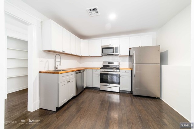 NEWLY RENOVATED spacious 3 bedroom & 1 bathroom apartment in the heart of Englewood business district. Fully Equipped kitchen w/ALL new stainless steel appliances. Beautiful hardwood floors throughout and large windows allowing for great natural light. Sun drenched open dining rm & living room which leads to the new eat-in kitchen. The primary bedroom features large closets, 2 additional bedrooms, and a full bathroom complete this apartment. Other great features: central AC/HEAT, high ceilings, recessed lighting. Freshly painted. Located in IDEAL location with public transportation at door. A 3 mile drive to GWB. In close proximity to shopping, great restaurants options and so much more. Laundry hook-up in basement. Tenant pays all utilities. Street parking. Fees due at signing of lease: 1st month rent + 1.5 month security deposit, 1-month broker's fee.