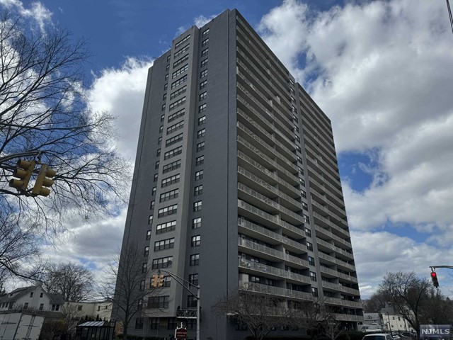 Experience the joy of luxury high rise living at Passaic Park's Carlton Tower. Spectacular, move-in ready 21st floor 1-bedroom unit with new vinyl flooring in main area and recently installed dishwasher. The unit offers tons of light during the day and quiet respite in the evening. The layout includes a spacious living room/dining area, plenty of closets for storage, and sizable bedroom. Views galore from your 30 foot balcony including NYC! The 24 hour doorman is ready to tend to all of your needs. Take advantage of community offerings such as the outdoor inground pool (membership required) or grill in the large backyard patio (reservation and fees may apply). Inhouse gym coming soon (membership required)! One outdoor parking spot is available for $40/month. NYC bus stop at corner of building. Train station a few blocks away.