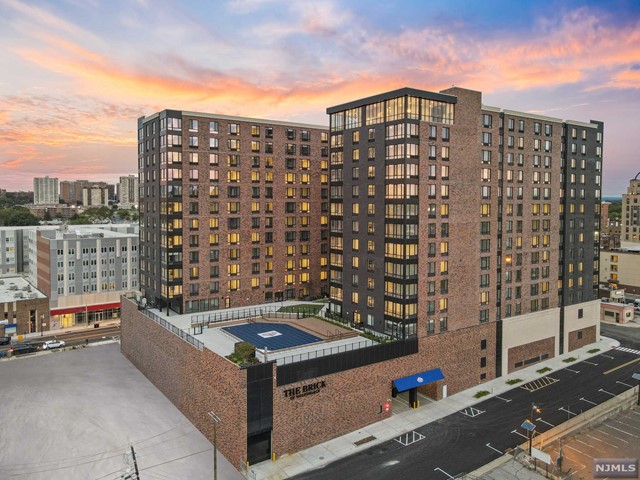 The Brick of Hackensack is a Premier 14 story luxury residential high-rise, boasting New York City style amenities in the heart of Hackensack's vibrant up and coming downtown. The Brick features 378 upscale apartments, secure garage parking and approximately 8,000 sq ft of retail space along Main Street. This building offers tremendous amenities including 24 hour doorman, Amazon Lockers, state-of-the-art gym, and yoga studio. The 'Oasis' courtyard features a luxury lap pool with adjoining sundeck and extensive green to be enjoyed with every season. The Brick also features a community room which is a great place to work from home. The crown jewel is the top floor Sky Lounge which impresses with an approximate 2,200 sq ft expanse and features a thrilling floor to ceiling view of the New York City skyline. Every unit in this building is spacious with an open concept floor plan, has high quality materials, and has washer and dryer in unit. Best of all, the Landlord pays the Broker Fee