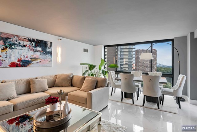 Truly, a sophisticated haven with captivating views! Offering timeless luxury, fully renovated condominium houses 2 bedrooms, 2.5 baths and a glass-railing balcony tailored to taste. Modern and chic, the entrance opens to a spacious living/dining area with coveted skyline views of the Hudson River and G.W. Bridge. Designed for fine living using the finest quality materials and craftsmanship throughout. European designed kitchen with frameless cabinets, full extension drawers, quality Frigidaire stainless-steel appliances & Carrara Blanco floors. Top of the line bathrooms meticulously curated in the KRION collection of Porcellanosa including a free-standing tub, Grohe shower body jets, modern wall mounted sinks and floor to ceiling Nantes Caliza tiles. Located at the prestigious Atrium offering full amenities including a fitness center, indoor/outdoor pools, saunas, tennis/basketball courts and walking trails. White glove service & concierge at your disposal.