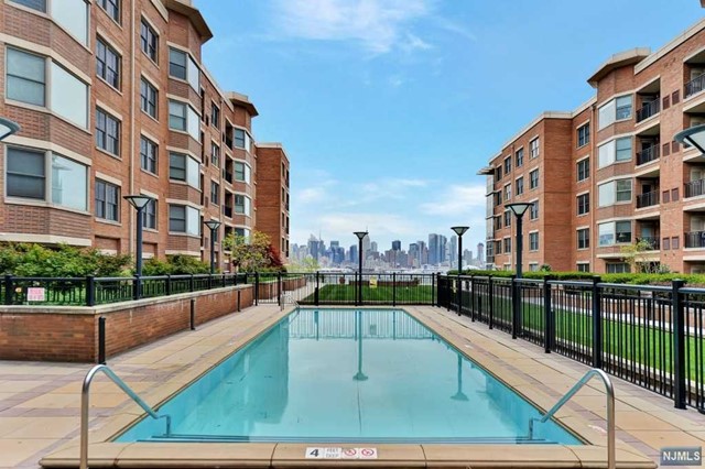 VIEWS VIEWS VIEWS! SOUTHEAST CORNER/END UNIT! 1,660 SF! A luxury waterfront community, the epitomy of urban meets resort lifestyle! Surrounded by retail on site (restaurants, supermarket, cafe, dry cleaner, wine gallery, spa, child play center) Dream commute to NYC in minutes via NY Waterway (free shuttle on site to ferry), Light Rail to Path/ NYC PA, minutes to Lincoln Tunnel/PA via NJ Transit bus EZ access to all major highways. Includes 2 assigned in building garage spaces, 24 hrs concierge, full amenities (outdoor pool, gym, club room,view courtyard.