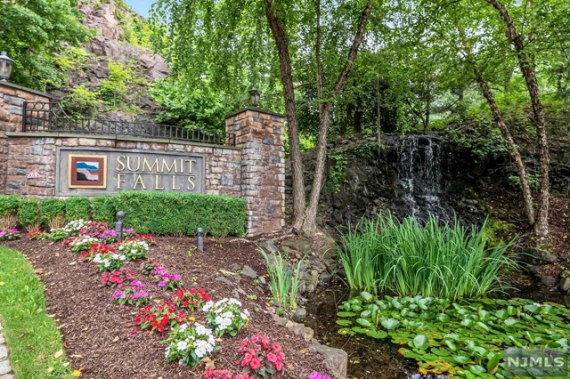 The one you have been waiting for to call home. Stunningly renovated end unit townhome offers a wonderfully open floorplan and magnificent mountain views. Walking through the front door you are greeted with new wood floors, sunlit living room and dining room. Meal preparation will be a dream in the chef's delight kitchen with glistening quartz counter tops, glass tile backsplash and never used state of the art stainless steel appliances. Enjoy morning coffee from your maintenance free deck. Casual entertaining will find you in a sun filled walk out lower level, featuring new luxury vinyl floors and recessed lighting. Days end retire to one of two spacious bedrooms. The sumptuous primary bedroom features cathedral ceiling, walk in closet & newly tiled bath. Hi end HVAC installed 2020 (3 ton 16 seer compressor). Freshly painted, simply place your furniture, move in & enjoy everything Summit Fall has to offer. Convenient to major highways, make this townhome your new home!