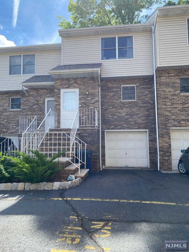 Beautiful, Spacious 2 bedrooms townhouse, conveniently located with in short distance to center of town, shopping, local and NYC transportation.Finished basement, laundry and utility room. This townhouse also features open concept first floor, kit,dinning room/living room with fireplace and sliding door to deck. On the second floor large master bedroom/ fbth, bedroom.