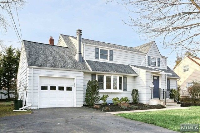 Welcome to this charming home! As you step inside, you'll be greeted by an inviting living room featuring a cozy fireplace. The main floor also offers two spacious bedrooms, an updated full bathroom, and a tastefully renovated kitchen complete with a breakfast bar and stainless steel appliances. The dining room provides easy access to the expansive backyard through its sliding door, leading to a new deck ideal for BBQs and relaxation. Upstairs, discover a generously sized primary bedroom, a fourth bedroom, and another newly renovated full bathroom. The basement has been newly renovated as well, offering versatile space for a home office, recreation room, and storage. An attached garage adds convenience. Nestled in a desirable neighborhood with access to top-rated schools, this house is conveniently located near shopping, dining, and NYC transportation. Don't miss out on this perfect blend of comfort and convenience! Please note: No pets allowed. Tenant insurance required.