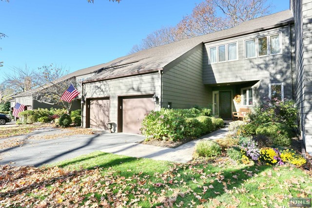 Located in the desirable Indian Field Community, this wonderful townhome is not to be missed. Surrounded by mature trees, flowers, clubhouse, tennis courts, playgrounds, peaceful meditation pond & community pool, sits this spacious townhome that is sure to impress you. Features you will enjoy are the expansive kitchen, cathedral ceiling living room with wood burning fireplace and new windows, expansive dining room with deck access, inviting master bedroom with updated bathroom and additional storage, upper-level loft, and finished lower level. Don't miss the first floor attached garage, new heating and central air conditioning, new driveway, first floor hardwood floors and much more. Mahwah offers a wonderful quality of life with great shopping, ease to NYC transportation, award winning schools and delicious restaurants. Call today! You will fall in love.