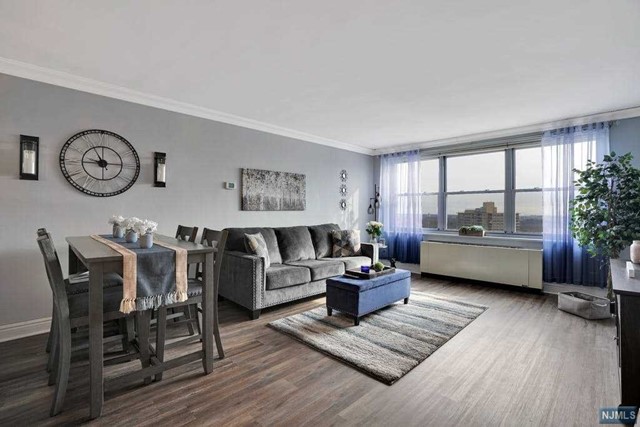 Welcome to this BEAUTIFULLY RENOVATED 1 bdrm penthouse! Embrace your daily sunrise & eastern view stretching across the GW corridor towards LI. Updated EIK w/granite counters, ss appls, tiled flooring & pass thru window to DA/LR allows for addl stool seating. Brand new flooring has just been installed throughout. Bdrm offers dropped-ceiling recessed lighting and huge walk-in closet. Several other hall closets as well. Full bthrm has also been delightfully renovated. Bldg offers 24/7 concierge & security, on-site mgt and maintenance, F/T handyman, comm room, playroom, athletic courts, bbq grill area, playground and laundry room on each floor. Gym, pool and storage available for addl fee. Cable/int $69.50 monthly. Indoor monthly pkg $85/outdoor $70 (assigned after closing). Free shuttle for Columbia Presbyterian employees across from bldg. Close to GWB, NJ hwys, parks, restaurants and shopping. Excellent Schools ! Cash Buyers w/o debt must show minimum of $53k annually to qualify.