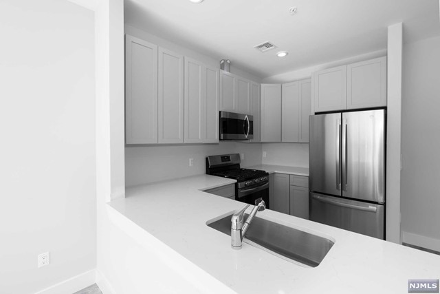 ONE MONTH FREE RENT!!! BRAND NEW CONSTRUCTION Apartment is ready to be Your New Home! Modern Layout featuring an Open Concept with Large Windows for tons of Natural Light to shine in! Beautifully Designed Kitchen features Quartz Counters with Brand New Stainless Steel Appliances. Central Air, Recessed Lighting and Washer/Dryer in unit for your convenience! Conveniently located close to everything, walking distance to Anderson St. Train Station, Bus Stop, Restaurants, Markets, Shops, etc. Sorry, no smoking and no pets allowed.