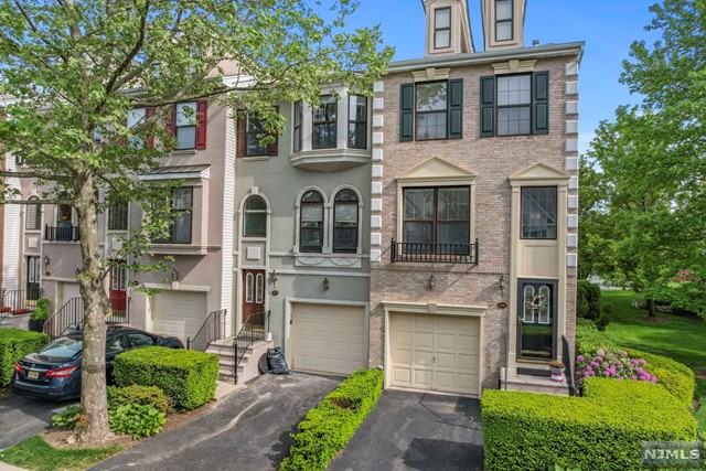 Welcome Home to Cambridge Heights. Highly Sought after gated community offers every home owner the luxury of owning a home with access to outdoor pool, gym, tennis court, & Pet friendly development with playground. Enjoy the communities outdoor space with a morning stroll or bike ride. This 2000 sqft home offers 2 bedrooms & 2.5 baths, with large En-suite Bath including jetted tub, & Shower in Main bedroom, Vaulted Ceilings and two large closets. Secondary bedroom has(2) skylights radiating plenty of sunlight. If that isn't enough full ground level walk out provides ample space for entertaining, and leads directly into attached garage. Bus stop to NYC directly outside of the community leaving a 30-45min commute.
