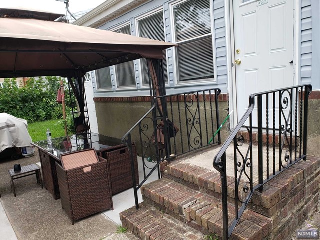 This renovated home on a quiet Cul-de-Suck offers a spacious layout, modern upgrades, a private large backyard & large garage provides secure parking & extra storage space.This spacious 4 Bedrooms,2.1 bath,3 level home,walk-out finished basement w/full bath,family room, office. flex room, 1st level,has 2 bedrooms,full bath,& kitchen features granite countertops,an island for added workspace, and stainless steel appliances,quality cabinets.The open concept design connects the beautiful kitchen to the living room & dining area, creating a seamless flow and a welcoming atmosphere.Hardwood flrs on both levels, 2nd flr offers,2 bedrooms & half bath.Enclosed all season porch that overlooks the private backyard.The convenience of laundry/hookup 1st flr. Central Air, The property benefits from its proximity to amenities such as a bus stop on the corner, shopping centers, and parks. This location offers easy access to transportation, entertainment, and recreational activities.