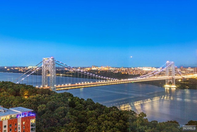Welcome to your large Hudson River facing two bedroom, two bathroom condo at The Palisades! As you walk into the living room, you are greeted with beautiful views of the George Washington Bridge & the Hudson River. The layout consists of 1326sf with the bedrooms at opposite ends. Kitchen features granite countertops. Building amenities include an elevator, 24 hour concierge, outdoor pool, children's play room, residents lounge, fitness center, cafe and visitor parking. 2 garage parking spaces included! Very conveniently located just minutes from New York City and nearby restaurants, parks and major highways.