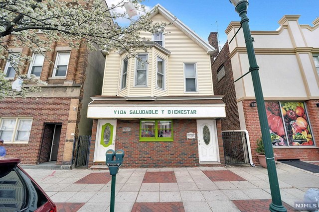 Mixed use building 3 units &store & 2 residential units. Building,store & apartments in good shape. Low taxes. Store approx 400 sqft, open concept w/ceramic tile floors,half bath & kitchenette $900 m/m, 1st fl rear apart 4 rms, 2 bdrms, kitchen, living rm, Bath & laundry rented $1,100 m/m. 2nd & 3rd fl used together w/8 rms 3/4 bedrms, 2 baths,kitchen, living rm/dining rm combo & laundry rented $1775 m/m. Unfinished basement.All separate heat, hot water & utilities. Store has electric heat, apartments 2 separate gas hot water baseboard heat systems. 2 gas meters & 3 electric meters w/updated panels. Residential units tiled baths & laminate floors. Monthly gross: $3,775; $45,300 per year.Expense:Taxes: $8,790, Water $1,000,landscape & snow $1,500, Insurance $2,800. Approx Expense total $14,090. Approx net yearly income $31,210. Solid investment with approx 5.5 cap. Includes 2 refrigerators & 2 washers/dryers.20 min walk to PATH station, #30 bus to Newark at corner! No rent control