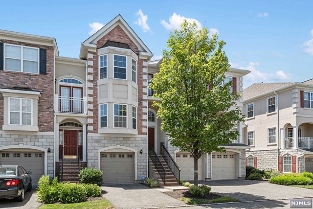 Bright and airy 2 bedrooms/2.5 baths with a finished walk-out basement/ Family room and a private garage, 3 level townhouse boasts up to 1945 Sq feet (Gramercy model) of living space, in desirable Riverside court Community. The first floor features an open floor plan with hardwood floors throughout, living room, dining room, and kitchen with granite countertops, 10 ft ceilings, recessed lighting & terrace. Top floor features a large Master bedroom suite with beautiful cathedral ceiling that boasts 2 His/ Her walk-in closets, luxurious oversized bathroom with double sinks, soaking tub, separate standing shower & balcony. Guest bedroom, Guest bathroom & a separate Washer dryer/ laundry completes the second level. Carpet in both the bedrooms. The walk-out ground floor provides an over-sized family room ideal for entertaining, & and access to the one car garage, Driveway Parking & glass slider to Outdoor Patio/ grilling area & yard.