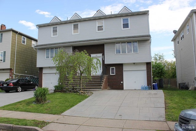 Wonderful opportunity to rent a large 1/2 Duplex on a quiet residential street in Elmwood Park. This 4 Bdrm, 3.5 Bth unit has 3 floors of living space. Ground floor offers a finished Rec Room with access to Private Yard and Attached Garage. The first floor offers a half bath, large living room opening up to dining area, modern kitchen w/ sliding glass doors leading to private deck. The second floor boasts a large Master Bdrm w/ full bath, two more Bdrms, and another Full Bath. Washer/Dryer hookups on ground floor, Central Air/Forced Hot Air, Large Driveway w/ 1 Car Garage. Close to almost every major local highway and close proximity to NYC bus and train routes. Landlord pays water, tenant responsible for all other utilities. Proof of income and clean credit a must. Tenant pays 1 month realtor fee.