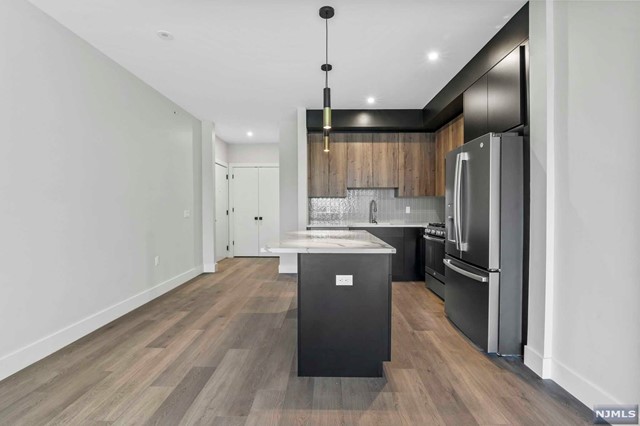 Welcome to LADDERMAN VIEWS! A Boutique 18 Unit Elevator Building Located Near Fort Lee's Main Street & The George Washington Bridge. Unit 206 Features 2 Bedroom, 2 Full Bathroom & 1173 SQFT. Equipped with High End Finishes, Modern Two Tone Cabinets, Quartz Kitchen Island + Countertops, Andersen Windows and Washer & Dryer In Unit. Two Bedroom Units Feature Heated Floors in Bathroom! Other Features Include: Virtual Door Assistance, Covered Parking, Elevator & Dedicated Mail & Trash Rooms. Conveniently Located Near Parks Shopping, Restaurants, & Transportation.