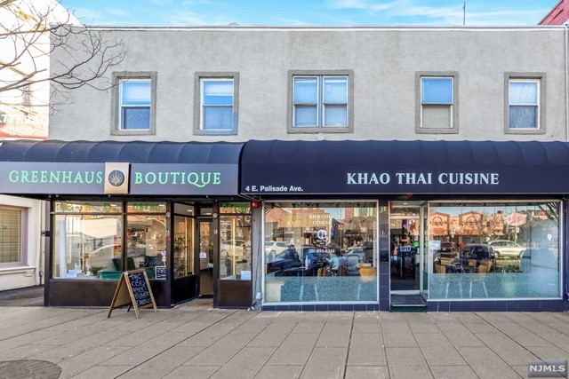 one of best location in heart of Englewood's busy business district; great opportunity to own income producing property: Two retail spaces on 1st floor, 7 apartments, multiple parking spaces in rear, Easy access to amenities, transportation & municipal garage parking. For further details, call LS- Anita Buchakjian