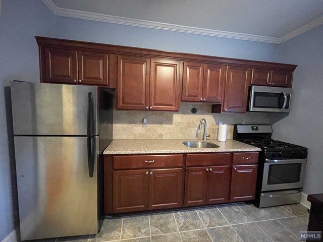 Love where you live! Introducing a recently renovated 1 bedroom unit at the beautiful Tudor Estates Building on Orient Way. This easy-living apartment is conveniently located to the bus and train to NYC and Hoboken. Tutor Estates is a charming building with classic Rutherford beauty featuring an onsite laundry room in the basement plus storage space. Unit C1 features a large bedroom equipped with 2 closets, a spacious and updated kitchen, living-room with a movie theater feel, coat closet, and tastefully updated bathroom. If that's not enough, some utilities are included in the rent: heat, hot water, and cold water. Don't miss the shared outdoor space where you can relax and unwind. Sorry, no pets. Parking on the street is stress-free and easy. Come see it today! LL will allow painting of LR.