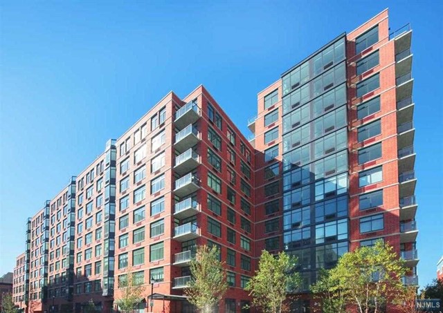 Welcome home to this stunningly oversized, 634 sqft, East-facing studio home with NYC & River views in Hoboken's luxury waterfront complex, 1400 Hudson St. This home offers the best of everything! Enjoy a gourmet kitchen featuring quartz countertops, Thermador refrigerator & gas stove, Bosch microwave & dishwasher. Home features a large open concept layout with oversized windows, espresso hardwood floors throughout & ample closet space. Enjoy Toll Brothers' newest project with world-class amenities including two gyms, a game room, pool, resident's lounge, 24 hour concierge, children's playroom, and rooftop terrace with outdoors BBQ and TV. Washer/Dryer included in the unit. Easy commute to NYC with shuttle service to the path and one block away from both the NJ Transit bus and NY Waterway Ferry. Parking available for rent at the parking garage. Available Now for move in.