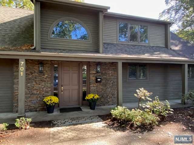 Peaceful, serene and tranquil describe the setting of this really cool contemporary in the highly desirable town of Ho-Ho-Kus. A 2 Story foyer leads to the spacious kitchen with center island and stainless appliances. The dining room is off the kitchen and is open to the spectacular great room with a FPL and a wonderful wall of windows to enjoy the picturesque views of the backyard. The deck is right off the great room for outdoor entertaining. The primary bedroom, which has enough closets for a fashionista to fill, completes the first floor. The second floor has 2 large bedrooms. full bath and a huge loft space for office/playroom/or teen hangout! Spiral stairs take you back down to the great room. The lower level has an intimate family room with a brick FPL, PR, laundry area and walk-out to patio. So much space, great flow, circular drive and riverfront use of the Saddle River for fun and a back to nature feel. Come feel the tranquility!