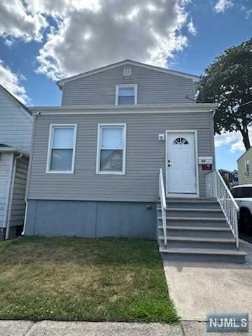 First floor features an eat-in kitchen, living room, two bedrooms, and full bathroom. One off-street parking space and shared use of yard. Close to parks, transportation, and schools.