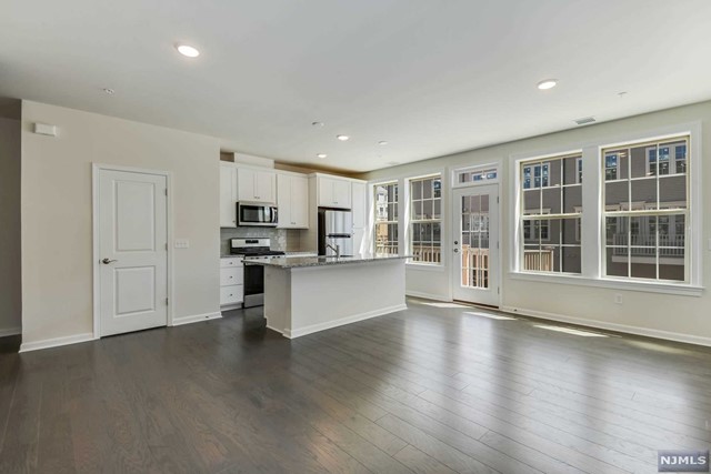 Witness a Brand New Construction Luxury Rental. Boasting 2 Bedrms 2.5 Bathrms, 1 Car Garage+ 1 Car Driveway & an Outdoor Deck,Move-In Ready Now. Brand new everything from Appliances to Floorings to Paint. Just pack your bags & move in Bergen County's most desired & sought after community. Top Elementary School, Commuter's Paradise & Easy Access to Groceries & Shopping!"ON-SITE NJ TRANSIT TRAIN STATION"& ON-SITE coffee & wine shop. Enjoy parks, children's playgrounds, tracks & fields for re-creation in the community. The inside of the home is designed to suit your modern lifestyle. Open concept layout, large windows bringing in abundance of natural light, energy efficient SS appliances, kitchen w/central island & dual temperature control thermostats. Completing the home are "TWO" LIVING ROOMS, generous sized 2 bedrooms, large walk in closets & a laundry closet. *No Pets Allowed*Available to move it today* Tenants pay-1 months realtor fee, utilities,1.5 months security deposit.