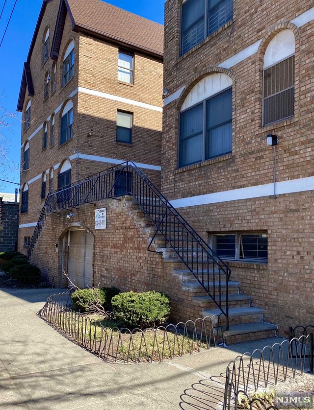 Beautifully Updated Large 1088sq. ft. 2 Bedroom Condo in Desirable Ironbound Section of Newark. Second Floor Unit Featuring Open Floor Plan Living Room with Stone Fireplace and Balcony, Modern Eat-In Kitchen with Stone Countertop, New SS Appliances and Dining Area, 2 Spacious Bedrooms, Full Bath with Jacuzzi Tub, and Laundry. Unit also has Newly Finished Hardwood Floors, Newer AC/Forced Hot Air Unit replaced in 2019, Recessed Lighting Throughout, Double Pane Windows, 2 Indoor Parking Spaces and Close to Everything!!!