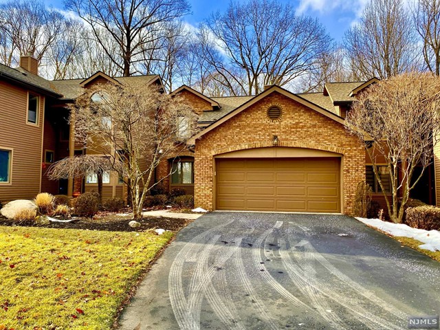 Your gorgeous townhouse has everything. Entertain or just relax. Main floor boasts: Stunning view of the lake from your oversized deck! Master bedroom with lake view and attached master bath with a soothing whirlpool tub. Two closets plus large walk in closet. Living areas: Chef's kitchen with granite counters, Viking appliances, hardwood floors, and breakfast bar. Cathedral ceiling living room with lake view, marble fireplace, hardwood floors. Also an ornate and convenient powder room for guests. Laundry room. The upper floor: First bedroom with lake view and large closet. Second with a huge walk in closet. Enormous walk in storage closet in hall. Full bath. Lower floor: Perfectly divided! Lower spacious living room has fireplace, an attached area with counter and wet bar. Utility half of lower level is an enormous store room with a large standing freezer, second refrigerator/freezer, laundry hook-ups, hobby sink, wall mounted storage cabinets, & shelving. Life is short, live it.